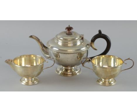 George V silver three piece tea service, comprising teapot, cream jug and sugar bowl with beaded borders, by S. Blackensee & 