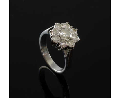 Diamond cluster ring, round brilliant  old cut diamond surrounded by eight round brilliant cut diamonds central diamond  appr