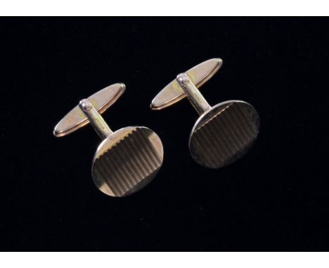 Pair of mid 20th C gold cufflinks with engine turned decoration Hallmarked 9ct.