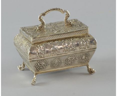 Victorian silver tea caddy of Dutch origin with import marks for Sheffield, 1895, variety of embossed hunting and other scene