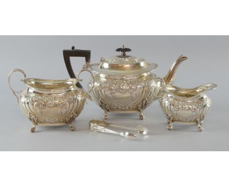 Edward VII silver four piece tea service, comprising teapot, cream jug, sugar bowl and tongs, with gadrooned decoration on fo