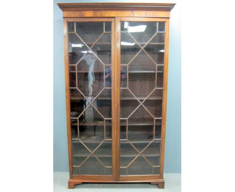 George III  mahogany astragal glazed two door bookcase on bracket feet, 215cm x 125cm x 36cm