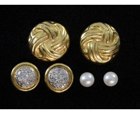 Three pairs of gold earrings, one set with diamond cluster another cultured pearl and twist disc design 18ct gold