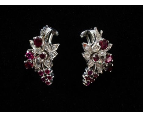 A pair of  1950's ruby and diamond flower spray clip earrings. Mounted in white metal tested as 18ct.
Provenance;  From the c