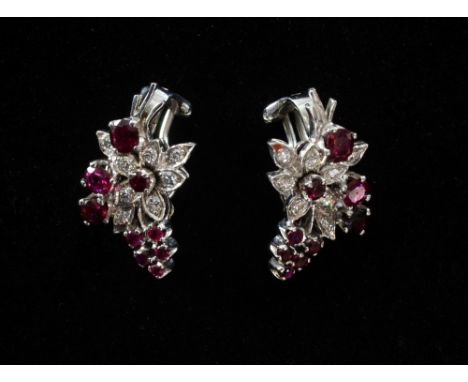 A pair of  1950's ruby and diamond flower spray clip earrings. Mounted in white metal tested as 18ct.
Provenance;  From the c