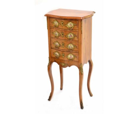 Attractive Continental small walnut bedside commode chest, the serpentine crossbanded top over four drawers, each applied wit