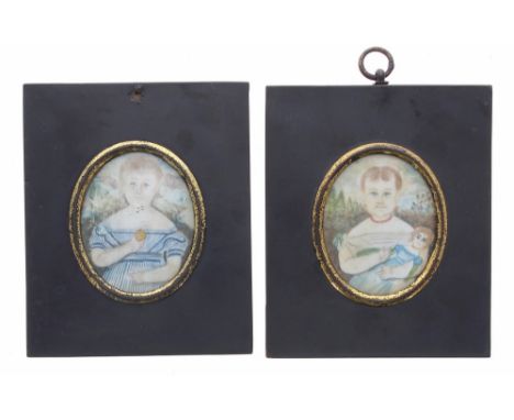 Pair of primitive portrait miniatures on bone, of children, the first with a biscuit, the second with a doll, oval 3" x 2.25"