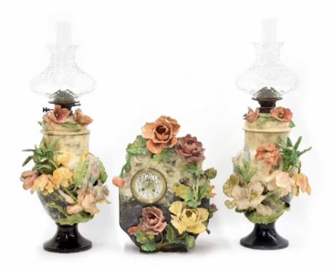 Late 19th century French Barbotine Majolica mantel clock garniture, modelled with flowers, the movement stamped H Marc, Paris