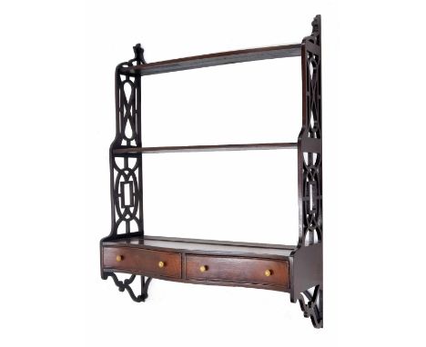 Chippendale style mahogany graduated three tier wall shelf, with fretwork side panels over the serpentine base inset with two