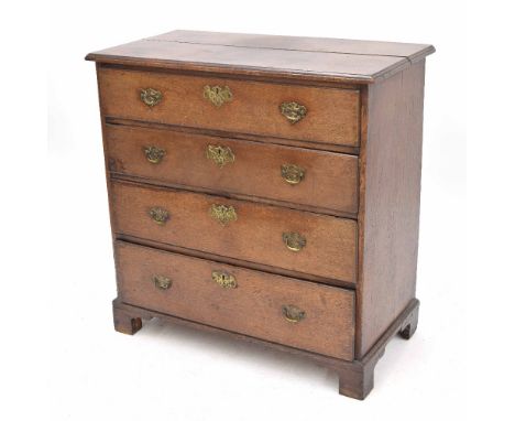 Georgian oak chest of drawers, the moulded top over four graduated drawers, with brass handles and escutcheon, upon bracket f