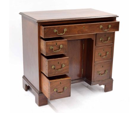 Small Georgian mahogany kneehole lady's desk, the moulded top over a single drawer over the recessed cupboard door flanked by