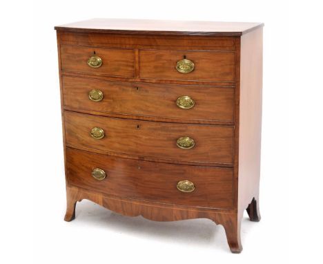 Regency mahogany bowfront chest of drawers, the reeded edged top over a plain frieze inlaid with ebony lines over two drawers