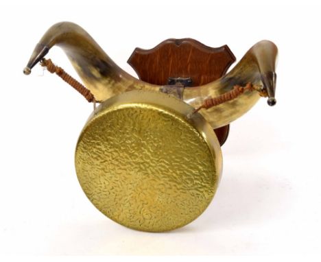 Brass dinner gong, hanging on horn supports with mahogany shield wall mount; together with a commode footstool and vintage Bl