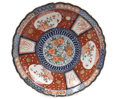 Good large Imari porcelain charger, decorated centrally with floral ring within panelled border ion a typical ground with sha