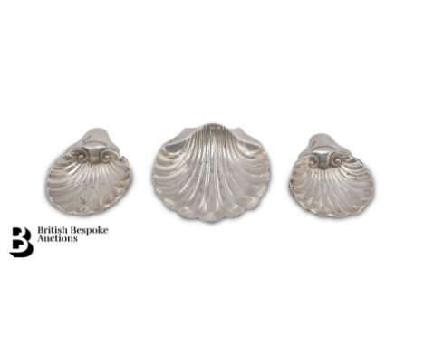 Three silver butter shells, small silver pair Sheffield dated 1924 James Deakin &amp; Sons together with another large butter