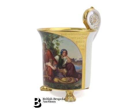 Mid-19th century KPM porcelain chocolate cup, Berlin, pillar form with a slightly everted rim, patera loop handle, raised on 