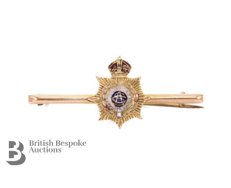 9ct yellow gold and enamel Army Service Corps bar brooch, (steel pin) approx 45 mm, 2.73 gms.&nbsp;