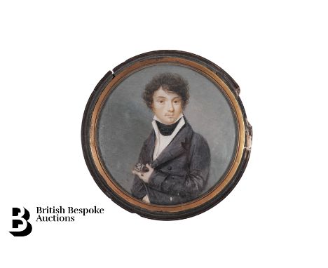 Early 19th century portrait miniature of a gentleman, clutching a portrait miniature to his breast, approx 70mm, signed to th
