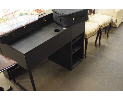 An Ikea black desk and over shelf unit