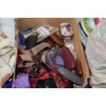 An assortment of items to include gentlemens clothing, bow ties, ties, assorted reading glasses,