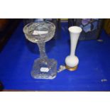 A cut glass candlestick together with small white vase with base