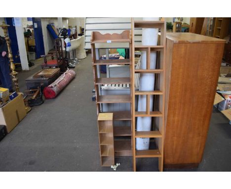 A group of three various assorted small shelf units