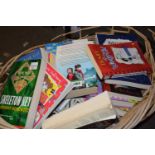 A basket of assorted reading books etc