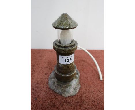 Polished hard-stone night light in the form of a lighthouse 