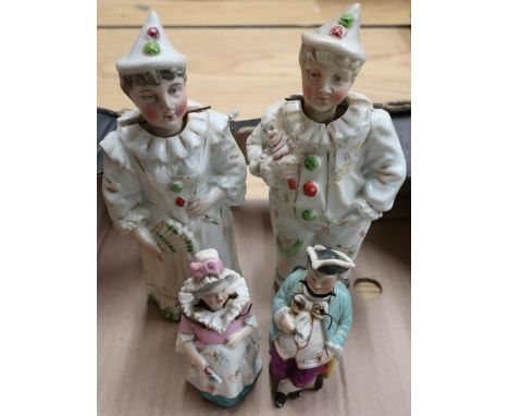 Pair of late 19th C nodding porcelain figures of Pierrot Clowns and a pair of late 19th C nodding figures of an old couple 