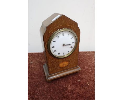 Edwardian inlaid mahogany time piece with white enamel dial, satinwood inlay, shell motif, brass ball feet, the movement stam