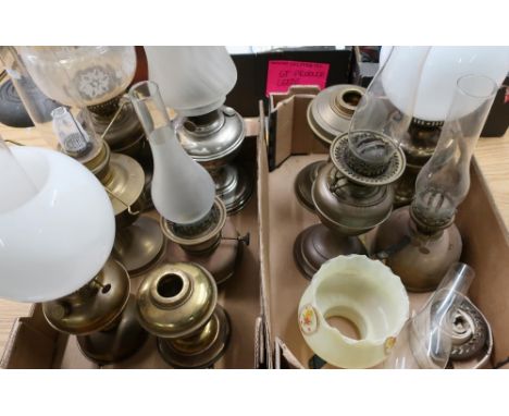 Early 20th C chromium plated oil lamp with frosted glass shade and nine other copper and brass bodied oil lamps 