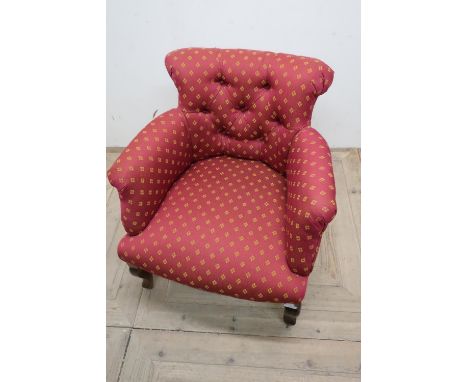 Early 20th C upholstered tub style armchair with deep button back and stained beech supports 