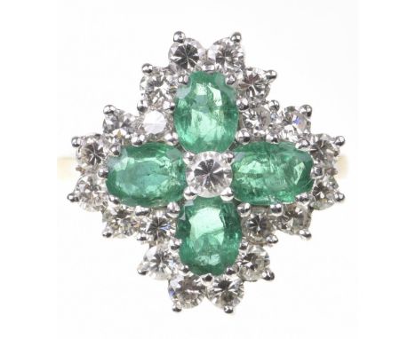 A emerald and diamond cluster ringThe oval-shaped emerald quatrefoil, centering a round brilliant-cut diamond, within a round