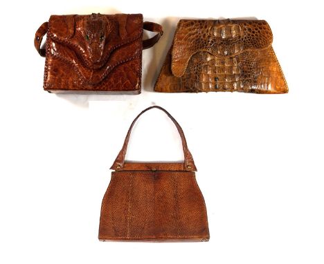 Two Vintage alligator clutch bags and a Vintage snakeskin handbag The first of tapered triform, the variegated tan to dark br