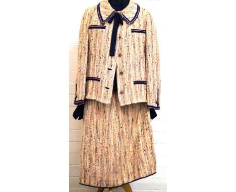 A 1950s wool Wallis Chanel style ladies skirt suitComprising a woven salmon pink and blue skirt, jacket with blue stitched de