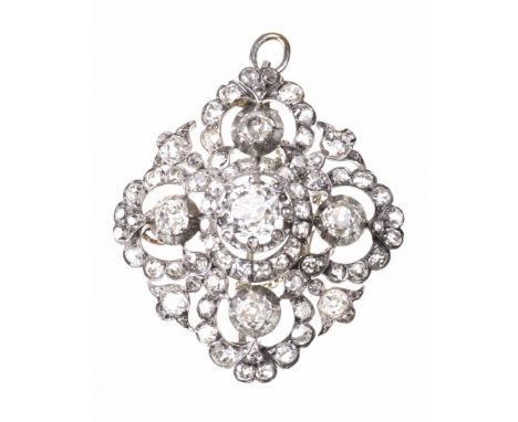 An exceptional diamond broochOf openwork quatrefoil design, centering an old mine-cut diamond, with rose-cut diamond set claw