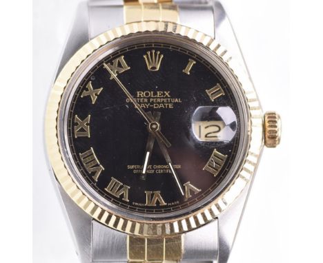 Rolex: An Oyster Perpetual day-date automatic bi-coloured metal bracelet wrist watch, circa 1987The signed black textured dia