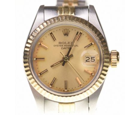 Rolex: A Ladies Oyster Perpetual automatic bracelet wristwatchThe circular signed gold tone dial, with gold tone baton marker