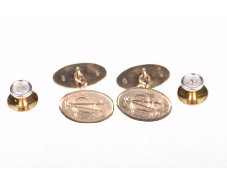 A pair of 9ct gold cufflinksOf plain oval form, monogrammed to one panel, together with, two 9ct gold button shirt studs (2)