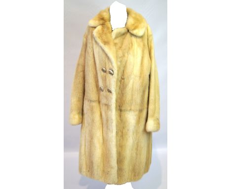 A ladies double-breasted blond mink coat Three-quarter length with scalloped lapel, and full length sleeve with button detail