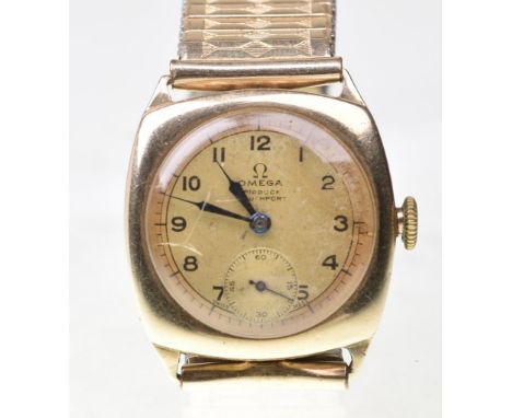 Omega: A 9ct gold manual wind wrist watchThe gold tone dial, with black Arabic numerals and black minute markers, subsidiary 