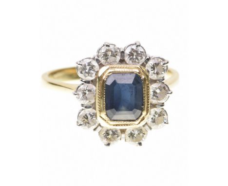 A sapphire and diamond cluster ring The emerald-cut sapphire to a yellow gold bezel setting, to a round brilliant-cut diamond