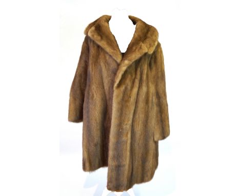 A ladies mink fur three-quarter length coat, retailed by Browns of Chester The light brown coat with full length sleeves and 