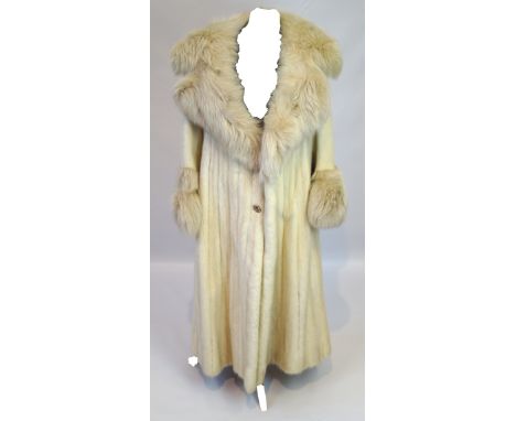 A ladies vintage white mink full length fur coat With full length fox fur cuffs and lapel, with central button detailing, len