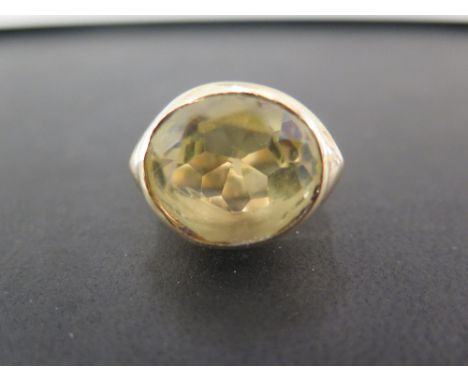 A citrine single-stone ring - Stamped 750 - Ring size J - Weight approx 21.4gms
Condition Report: Good to fair - With light s