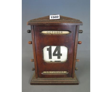 A mahogany roller desk calendar 26cm tall x 20cm wide - all rollers working