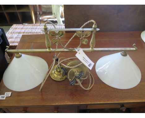 A brass twin shade rise and fall lamp
Condition report: In good clean condition 