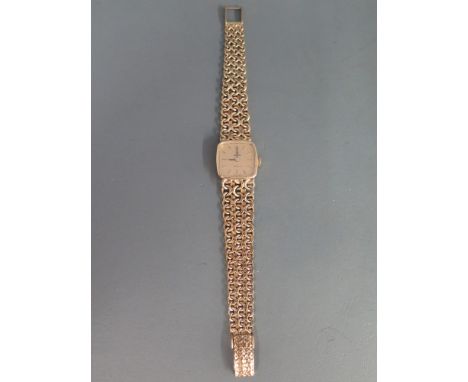 An Omega 9 ct gold Ladies manual wind link bracelet watch with gilt baton dial - Width 22 mm - Total weight approx. 34 grms 
