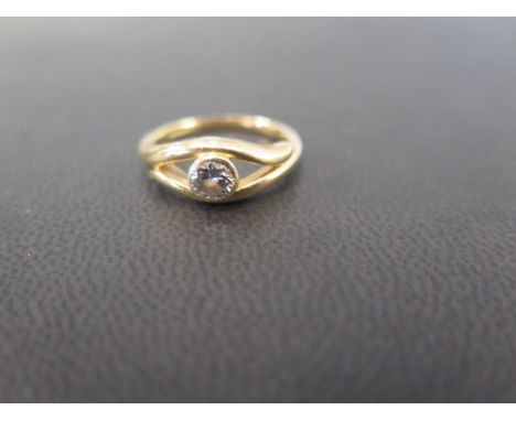 A diamond single-stone ring - The collet-set brilliant-cut diamond to the openwork surmount and plain band - Estimated diamon