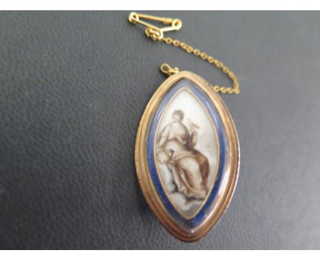 A Georgian gold memorial brooch - The miniature painted on ivory depicting a seated lady with a bird and a lamb, to the blue 